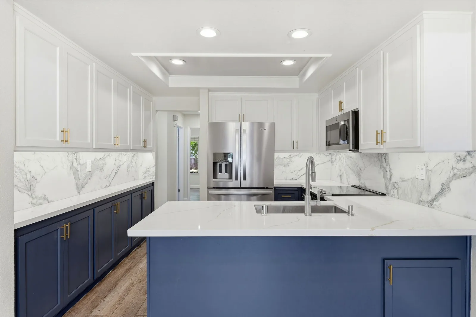 Renovated kitchen with quartz countertops at 2300 Lake Park Ct